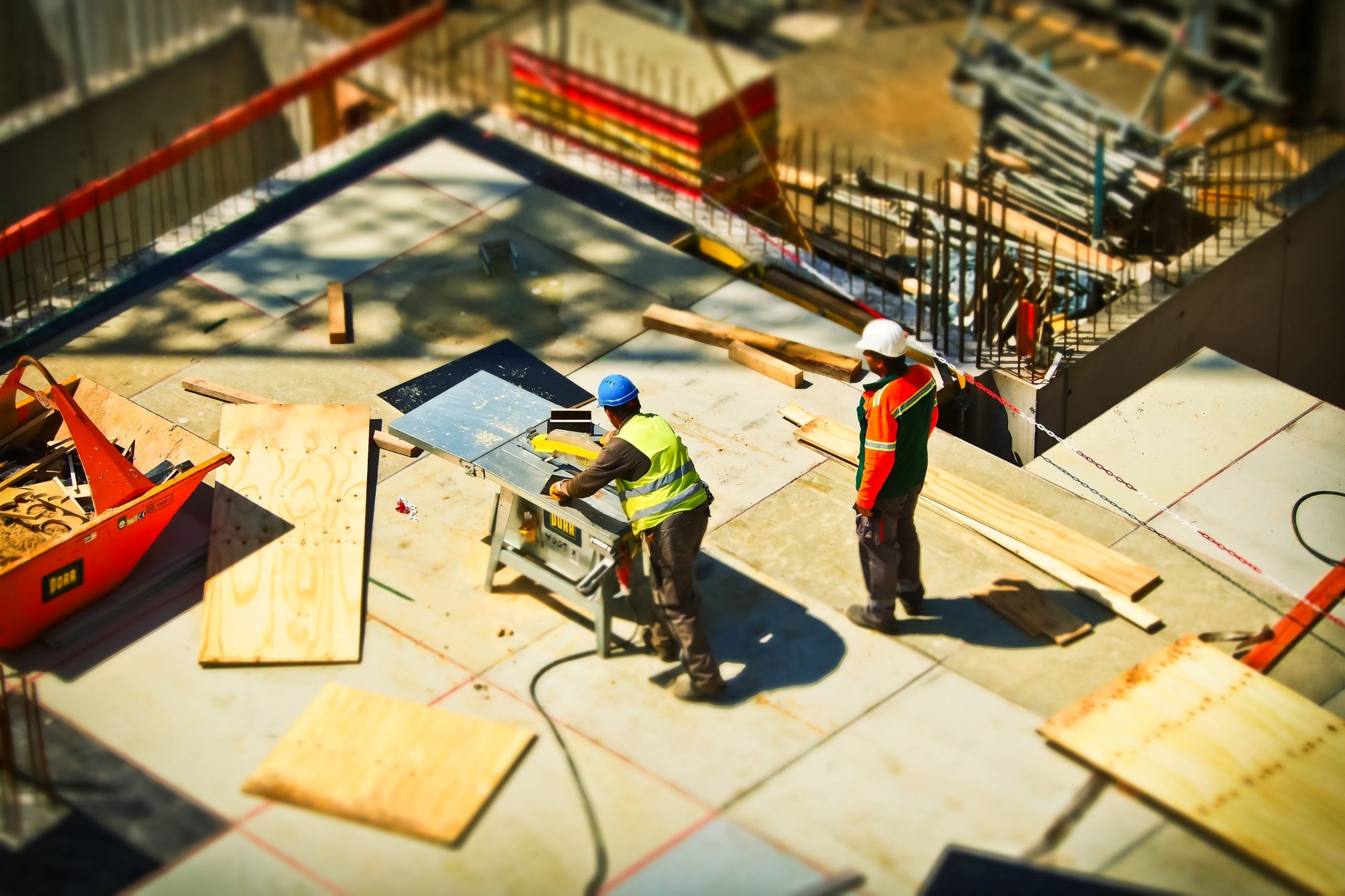 A birds eye image of two construction workers.