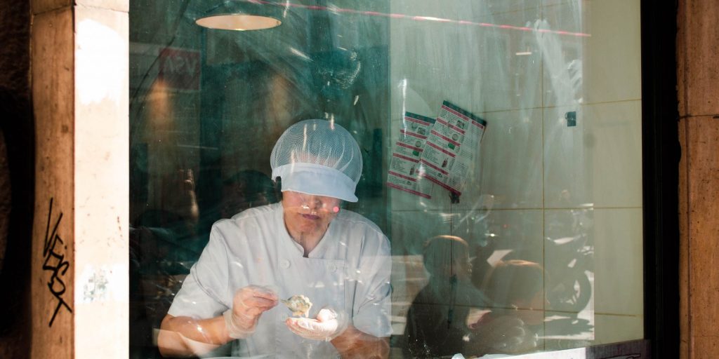 A woman packing meat.