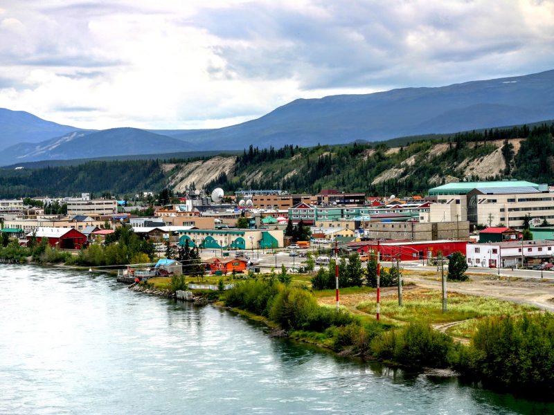 Yukon Whitehorse town near the river and mountain.