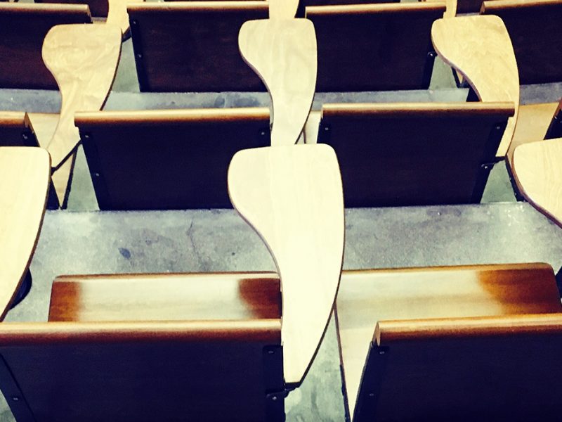 detailed view of a row of auditorium seats.