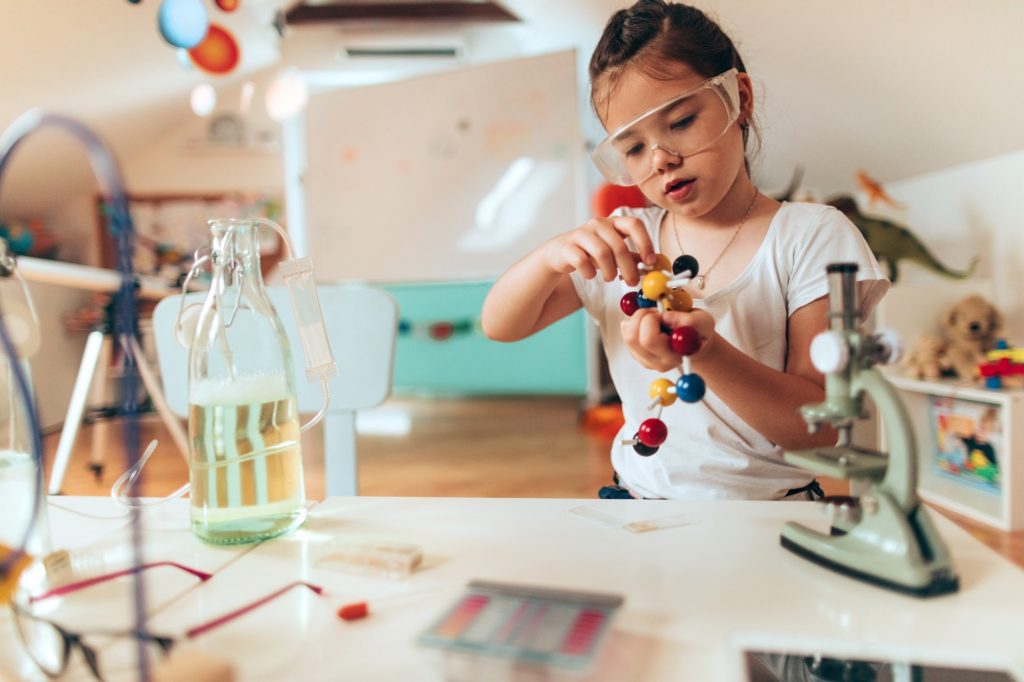 Child playing with molecule