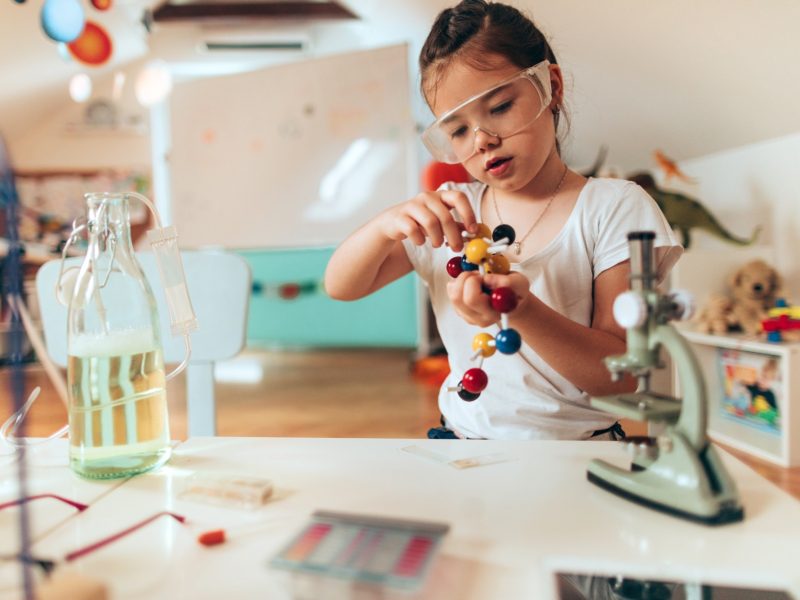 Child playing with molecule