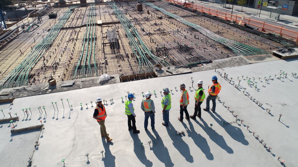 Aerial view of construction workers looking at their work-site