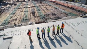 Group of construction workers looking at the work-site