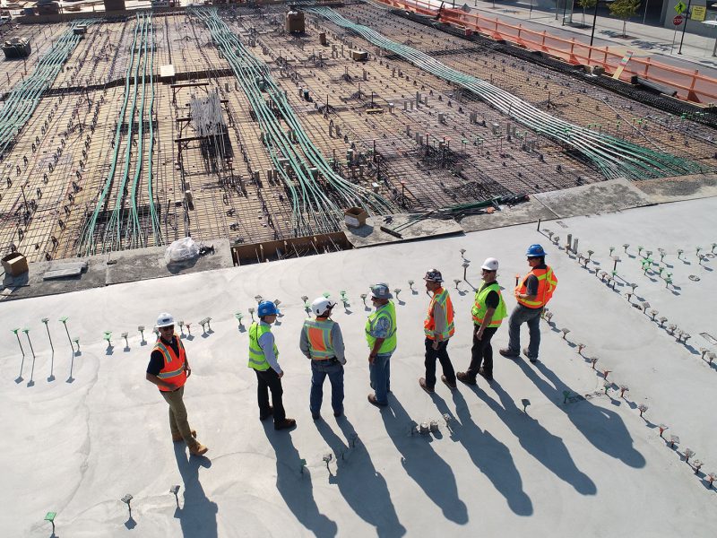 Group of construction workers looking at the work-site