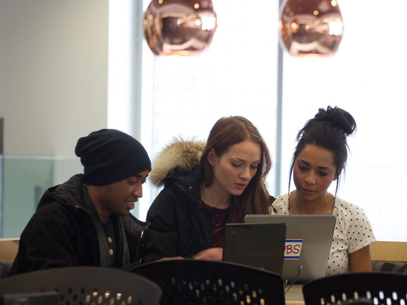 Students working together on their laptops