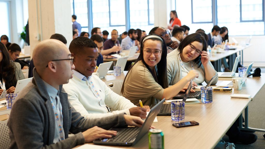 Diverse youth working on their laptops