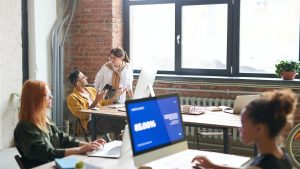 Diverse youth working on computers and laptops