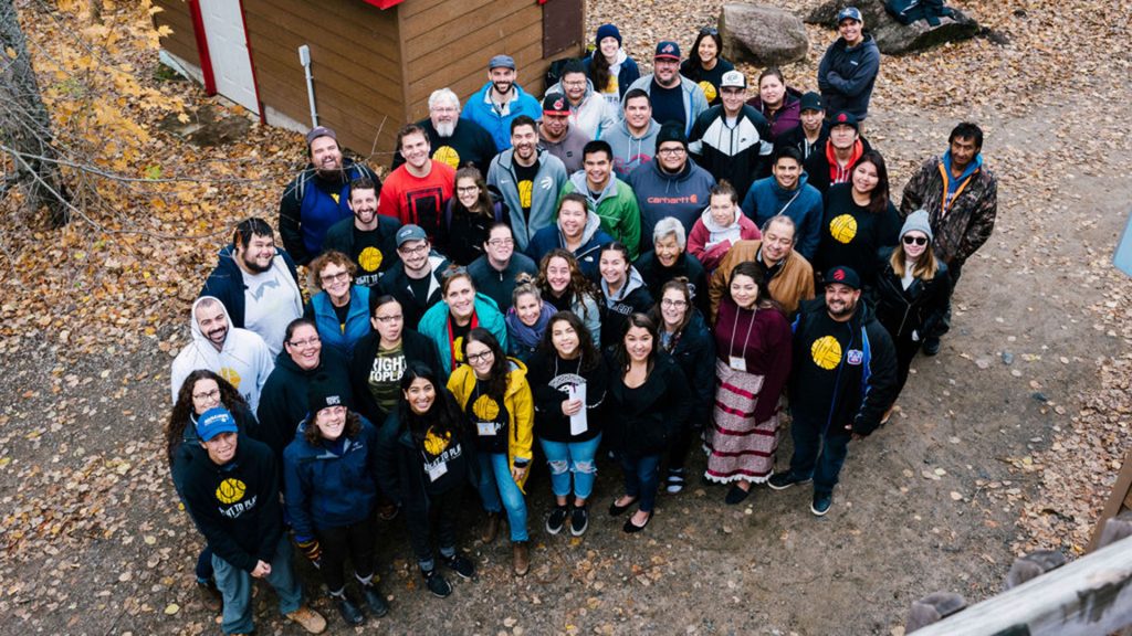 Overhead view of group of Indigenous people smiling