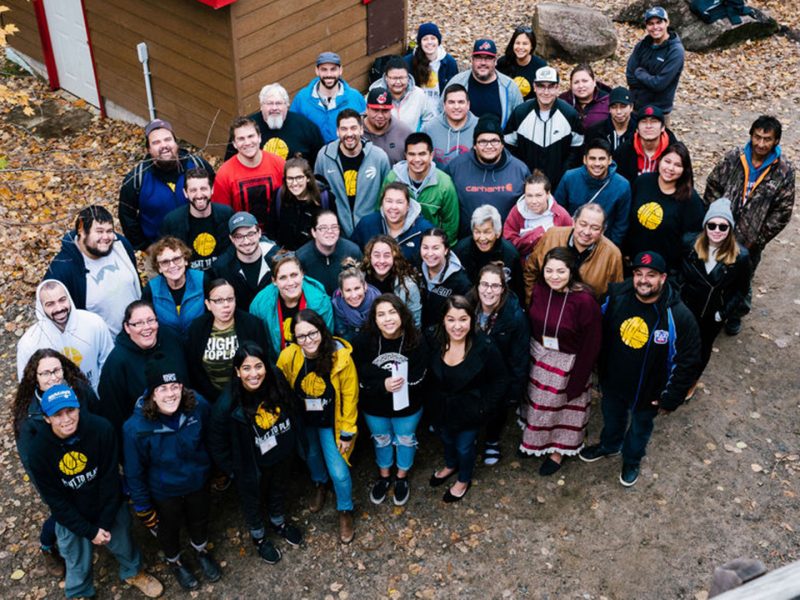 Overhead view of group of Indigenous people smiling