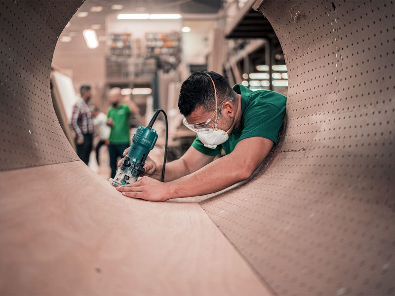 Man in green wearing mask