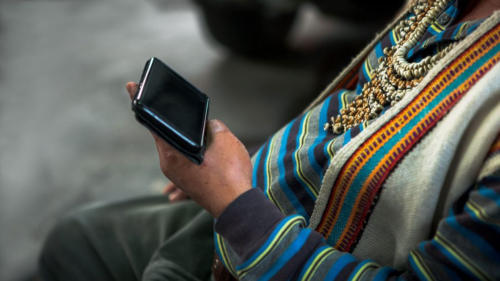 Indigenous Canadian using a mobile device