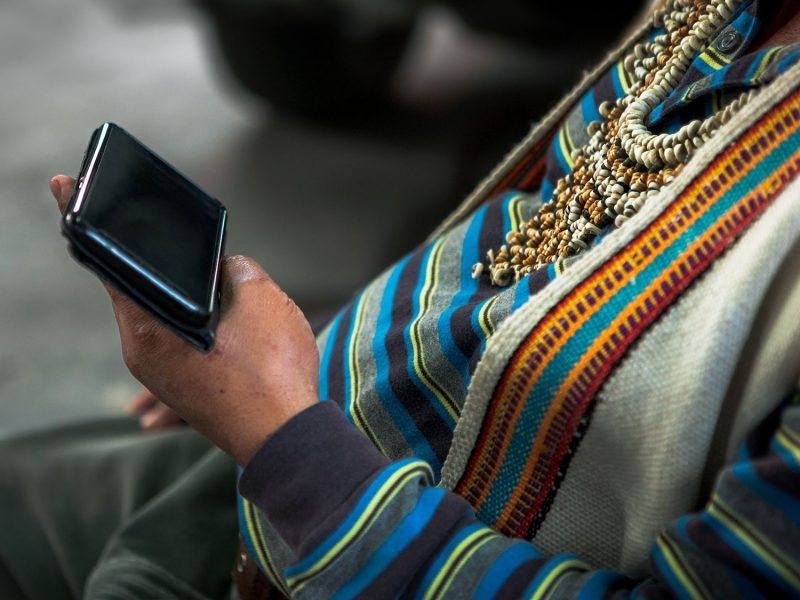 Indigenous Canadian using a mobile device