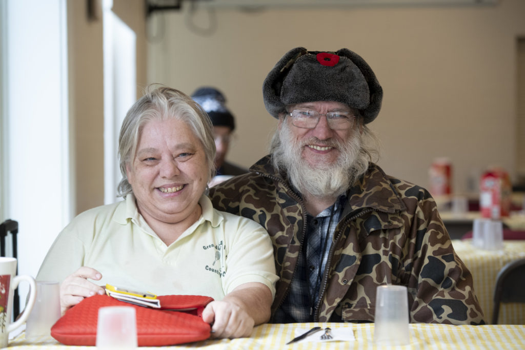 Image of individuals smiling at the camera.