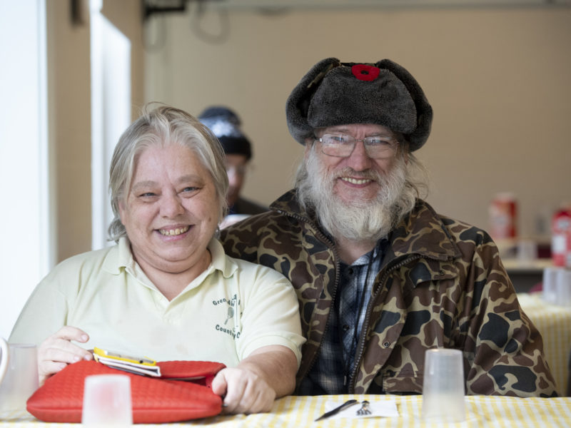 Image of individuals smiling at the camera.