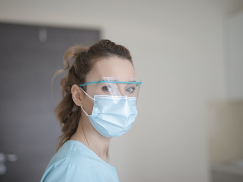 healthcare worker smiles with her eyes while wearing mask