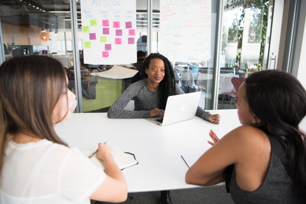 three employees working in an office environment