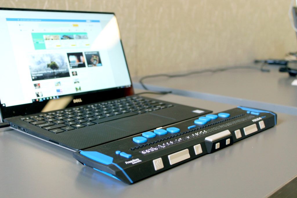 photo of a screen reader and laptop