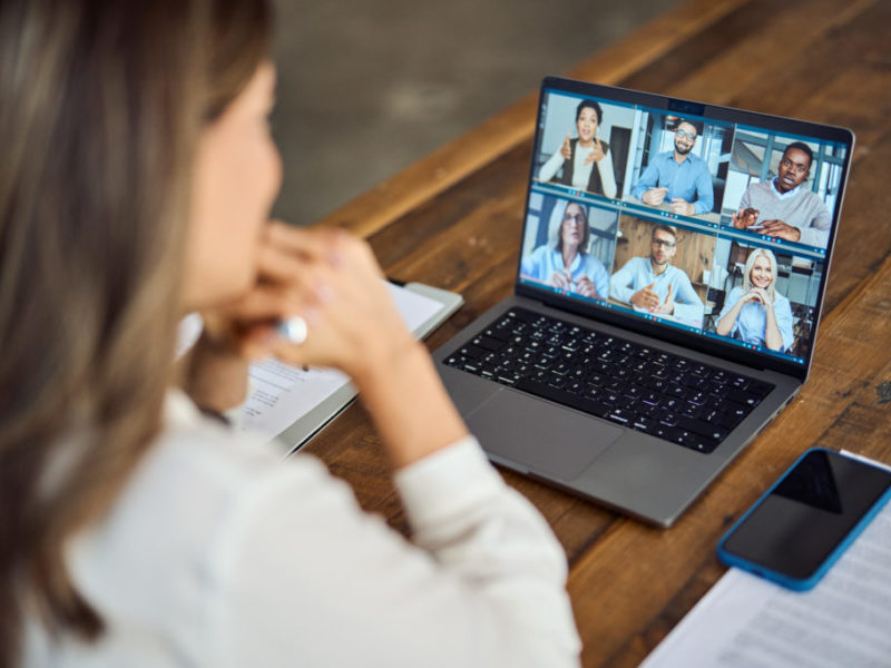 Business woman on a video call with several colleagues