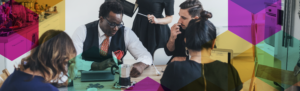 people around a table working on a problem in a professional setting