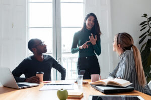 Person giving a whiteboard presentation to a group