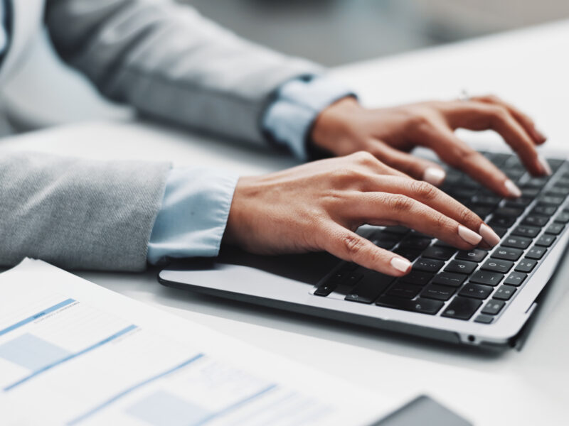 Laptop and hands of business woman
