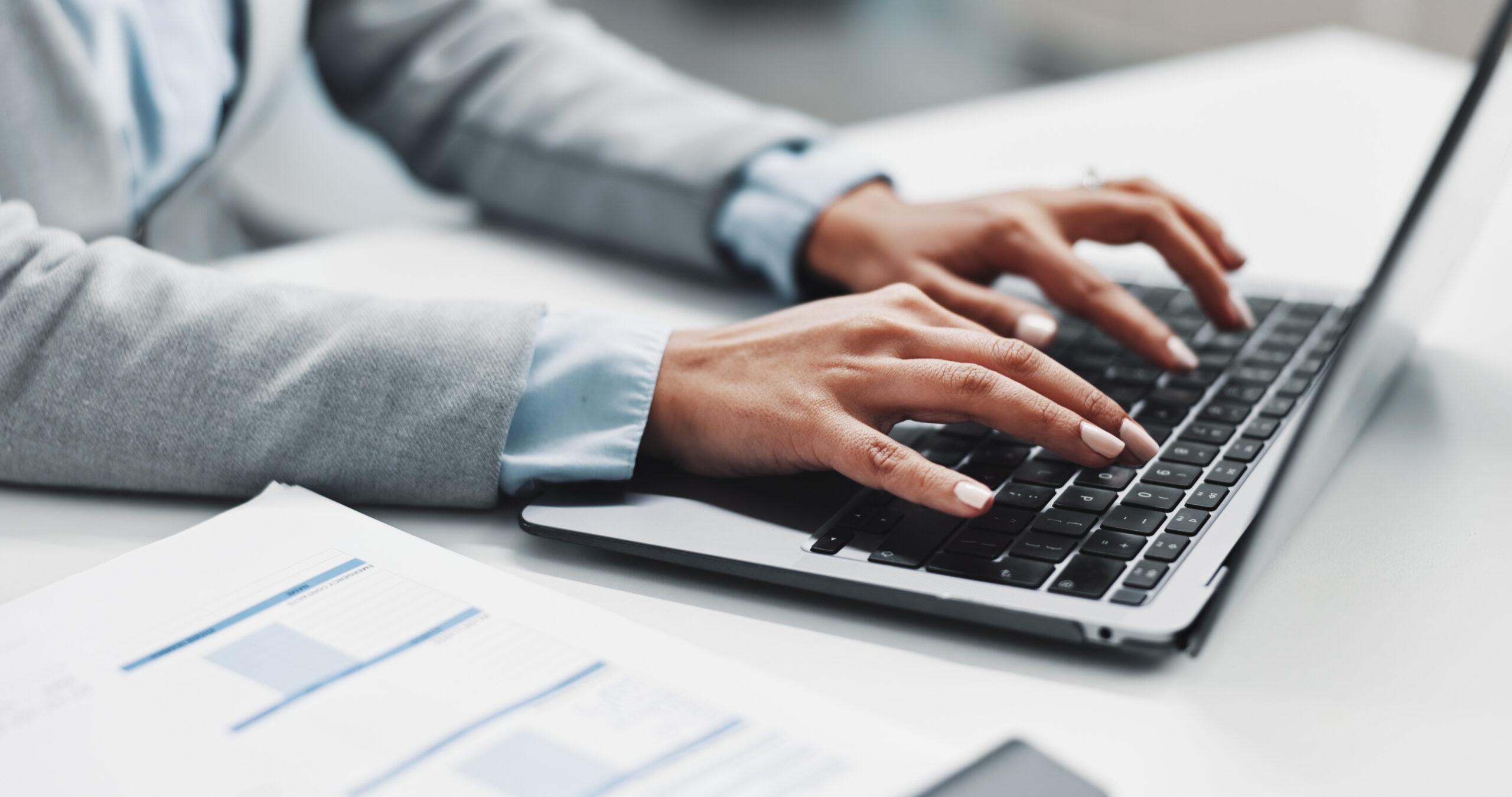 Laptop and hands of business woman