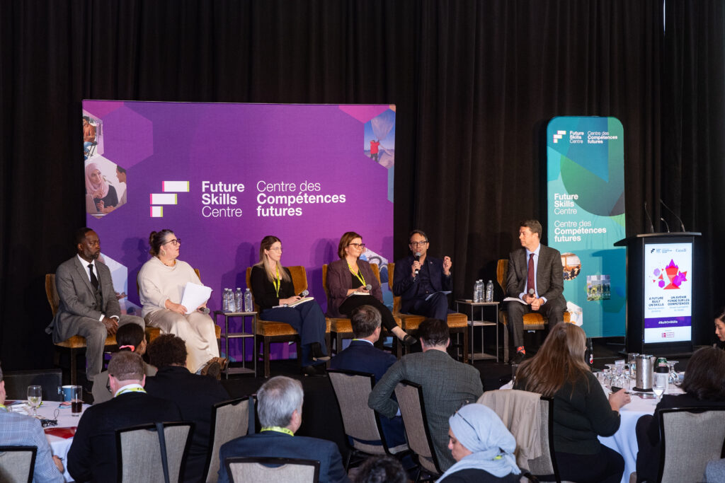 Panelists on stage at A Future Built on Skills