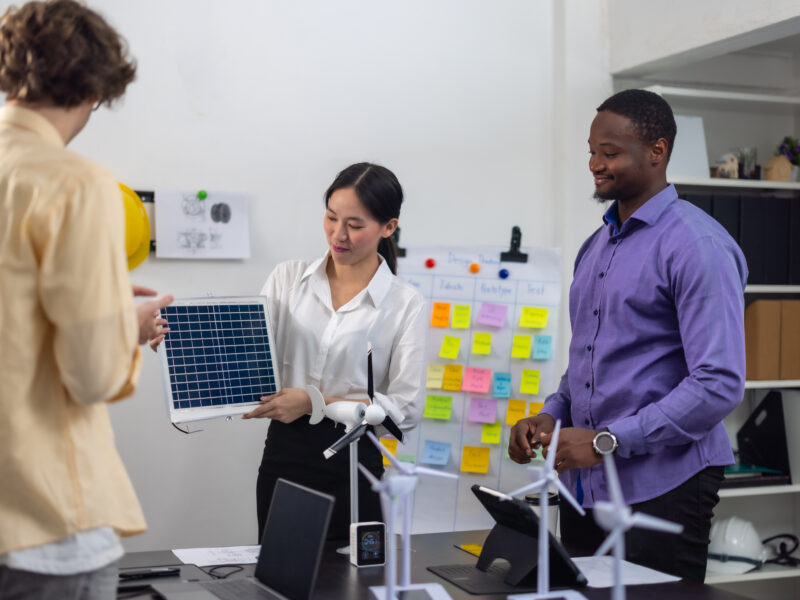 Renewable energy experts discussing solar panel project