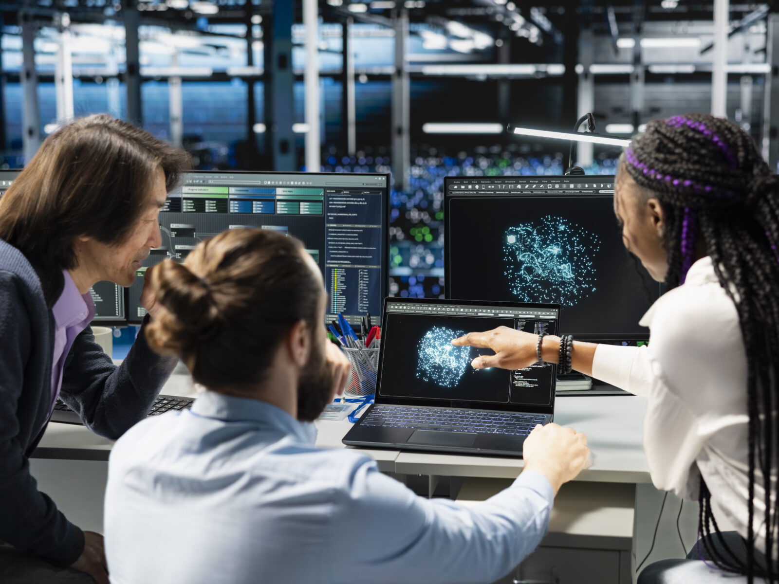 Coworkers doing brainstorming, monitoring AI applications