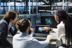 Coworkers doing brainstorming, monitoring AI applications