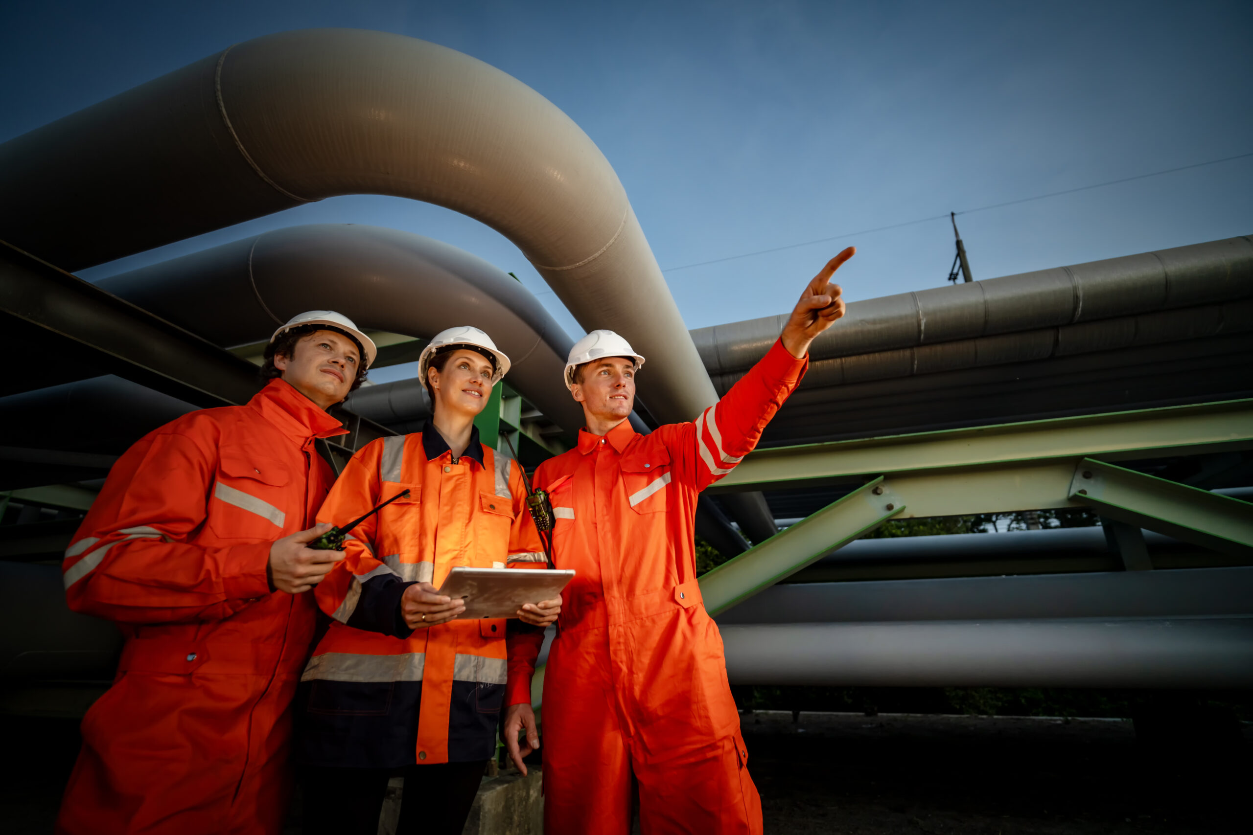 Refinery industry engineers working and talking