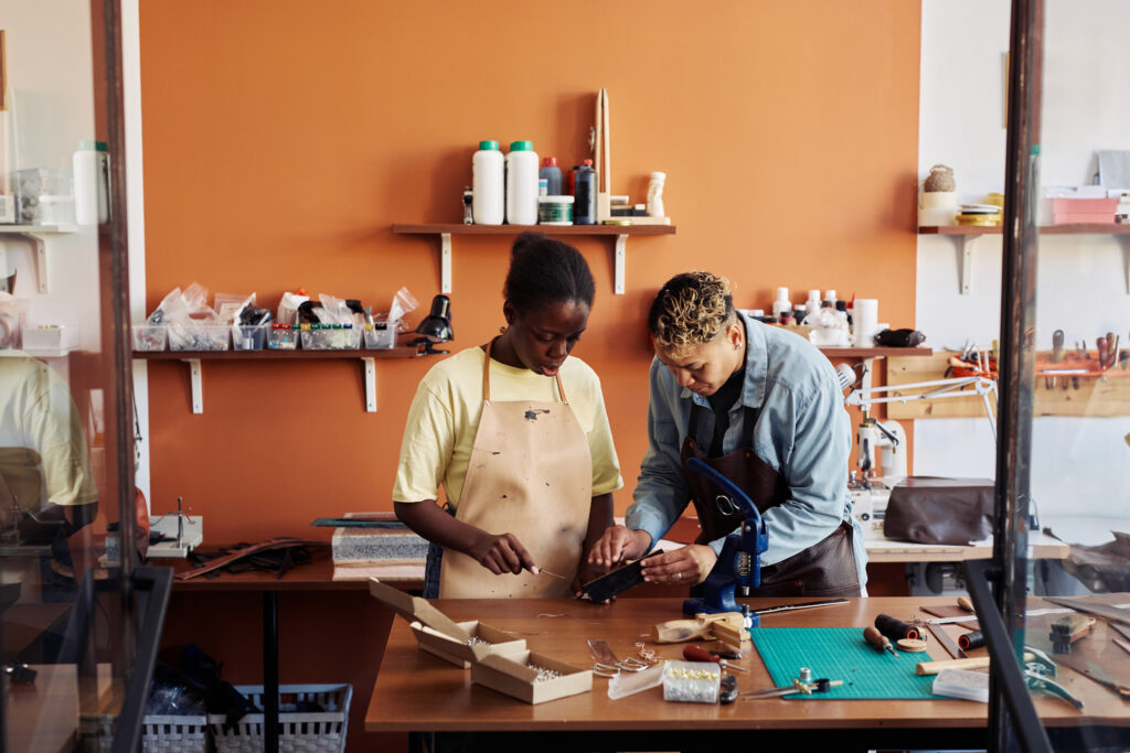 women working in small business leather workshop
