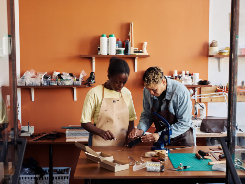 women working in small business leather workshop