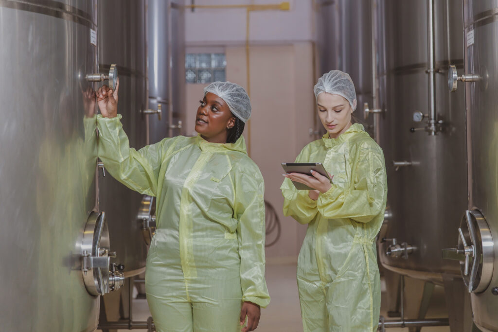 Workers working in modern large winery factory
