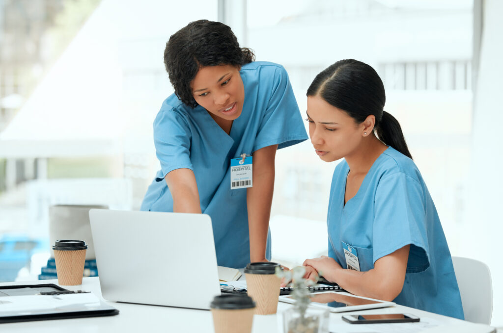 Nurses discussing at table