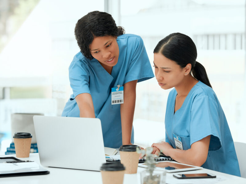 Nurses discussing at table