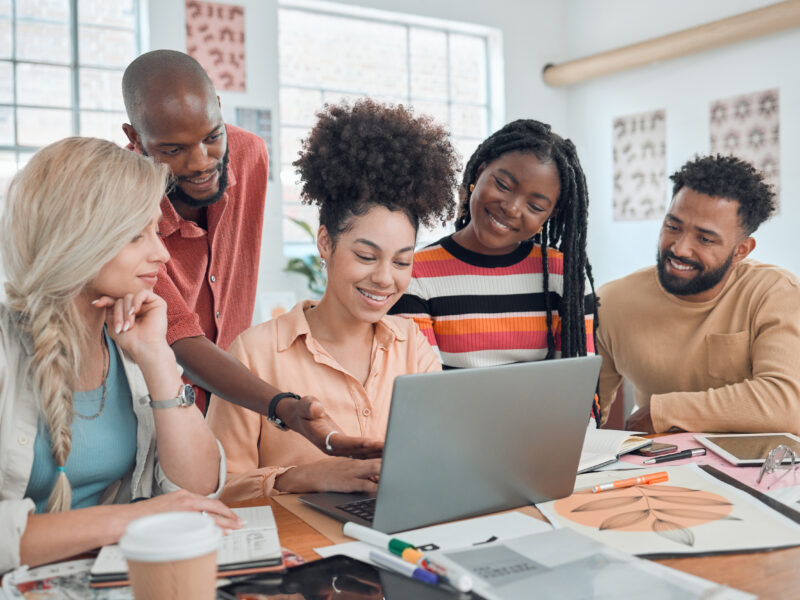 Group of diverse businesspeople having a meeting in a modern office at work.