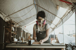 Female carpenter working in a workshop
